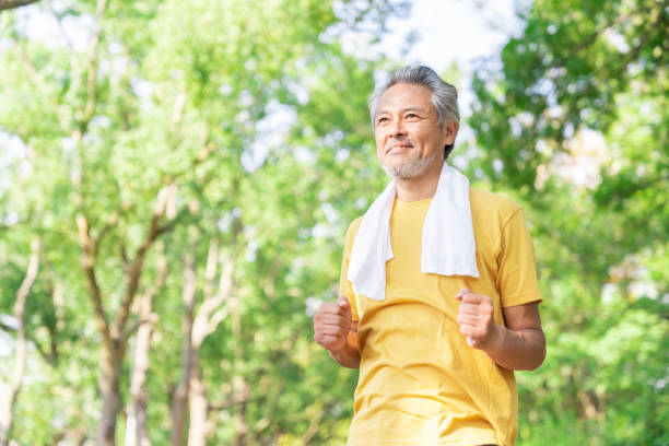 istock elderly man exercising in the park 1379659543