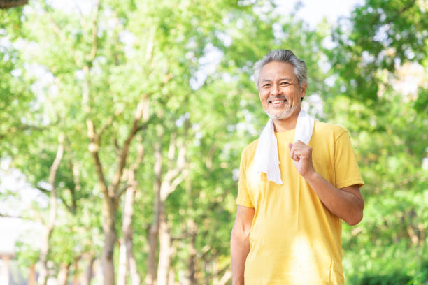 istock elderly man exercising in the park 1379661087