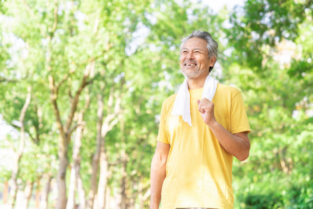 istock elderly man exercising in the park 1379661088