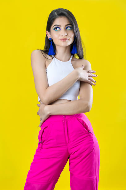 istock Portrait of model on yellow background 1379664033