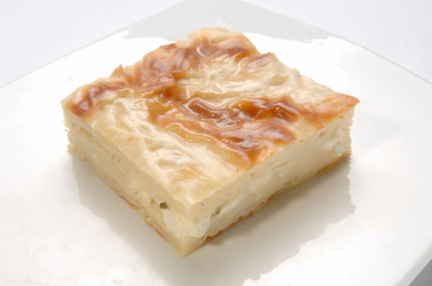 istock Turkish food su boregi, square borek white plate isolated 1379692119