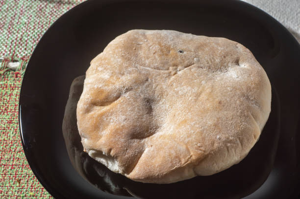 istock Syrian bread on a dish with copy space left and natural light 1379742637