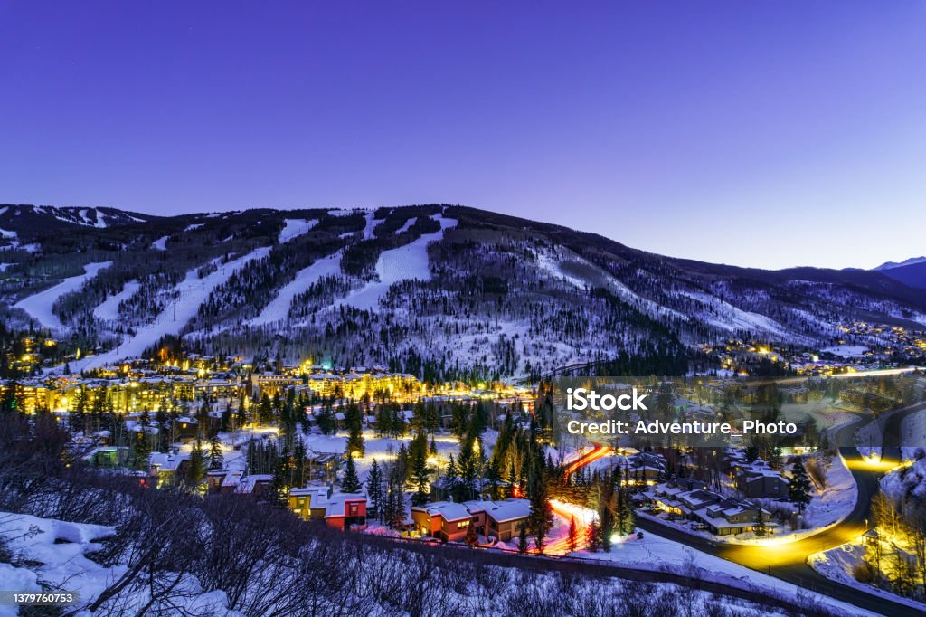 Vail Village and Lionshead Colorado Night View Vail Village and Lionshead Colorado Night View - Town of Vail, Colorado lit up at night in winter with ski runs on mountain above. Scenic landscape of one of Colorado's premier ski resorts. Colorado Stock Photo