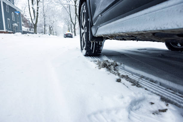 istock Parked Car Winter Snow Tire Tracks 1379789153