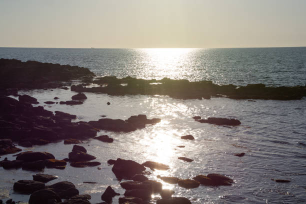 istock The calm sea reflecting the sun's rays 1379805761