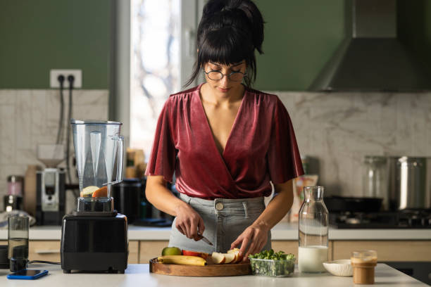 istock Young Woman Preparing Healthy Breakfast at Home 1379807876