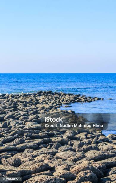 Giants Causeway In St Martins Island Bangladesh Magical Sunrise Clouds And Waves Hitting The Coast Giants Causeway Looks Like A Jetty Copy Space Stock Photo - Download Image Now