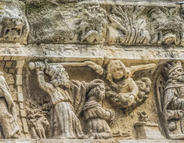 Abraham Isaac Angel Covenant Statues Facade Notre Dame Cathedral Our Lady and Saint Castor Church Nimes Gard France. Created 1100AD,