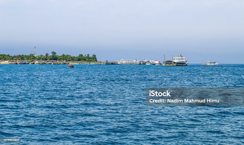 Tourist jetty of St. Martin's Island, Bangladesh. Photo of a seaport on an island with many ships docked. Good to use for outdoor and something about facilities or transporter content. Bangladesh Stock Photo