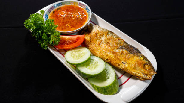 istock Fried milkfish on a plate ready to serve 1379859597