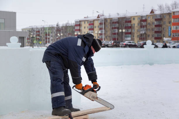 istock Fitter with a gasoline saw cuts long planks 1379880242