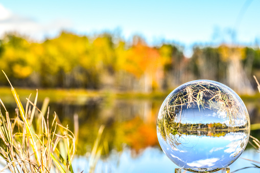 Fall colors are beginning to shine forth in Interior Alaska. The colors are reflected in a crystal ball creating a unique scene.