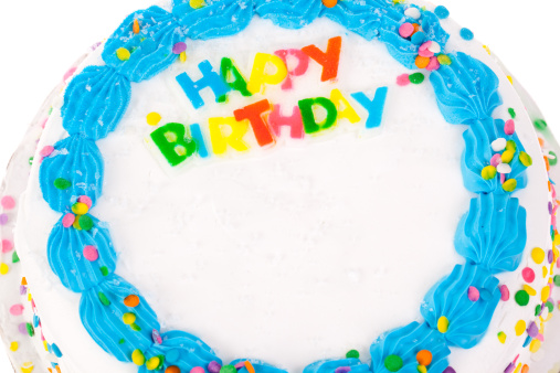 Top view of an iced birthday cake with copy space