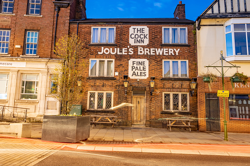 A commercial business called The Cock Inn on Derby Street of Leek in Staffordshire, England.