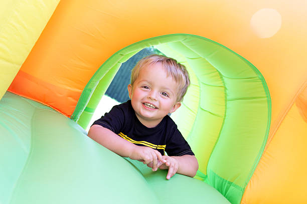 istock Child on bouncy castle 137996582