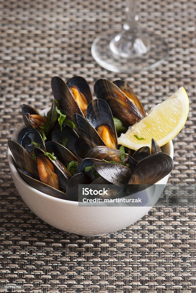 Mussels Fresh mussels with herbs in white wine sauce Crustacean Stock Photo