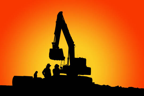 Wheel loader  silhouette are digging the soil in the construction site.With on  cloud and sky  background.