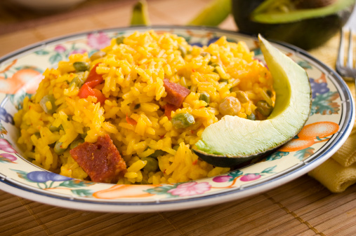 Traditional Puerto Rican dish. Yellow rice with pigeon peas, pieces of salami, and red pimiento.