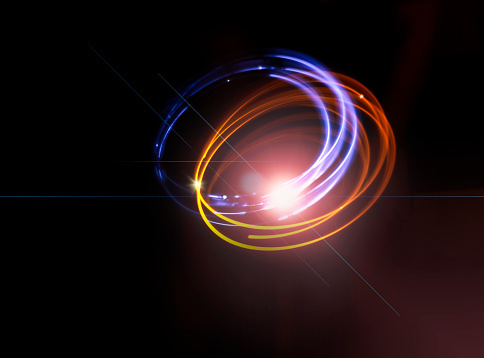 abstract background. Light rings and rays on a black background
