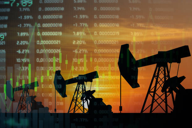 istock Oil pumps and graph 1380008819