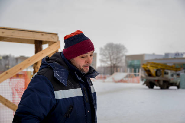 istock Close-up portrait of a worker at a construction site 1380013081