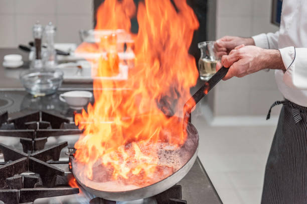 istock Chef prepares a meal in a  hotel kitchen 1380014648