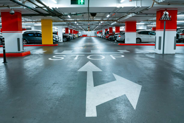 istock Parking garage underground interior background or texture. Concrete grunge wall and column with warning sign, industrial retro vintage interior 1380017766