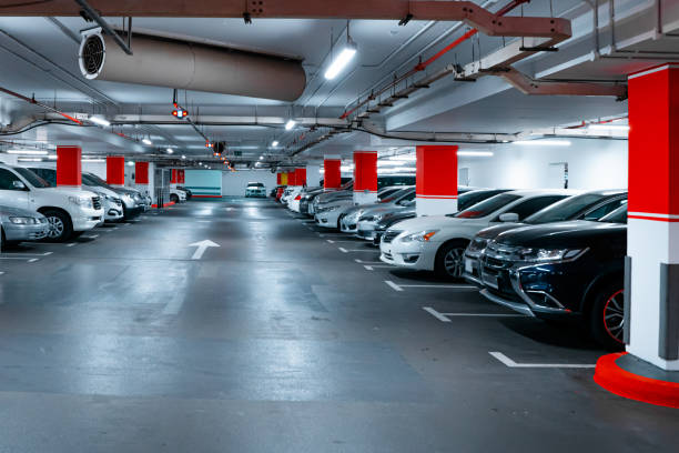 istock Parking garage underground interior background or texture. Concrete grunge wall and column with warning sign, industrial retro vintage interior 1380017933