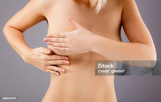 Woman Examining Her Breast Stock Photo - Download Image Now - 20-24 Years, Adult, Adults Only