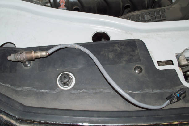 istock The oxygen sensor removed from the car is lying on the car 1380049445