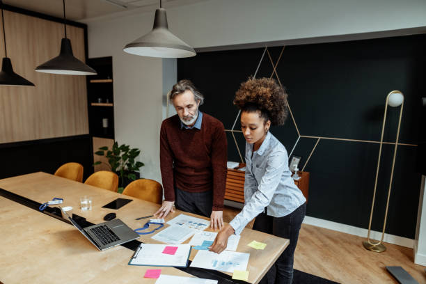 istock Serious diverse business people developing start-up investment scheme 1380079921