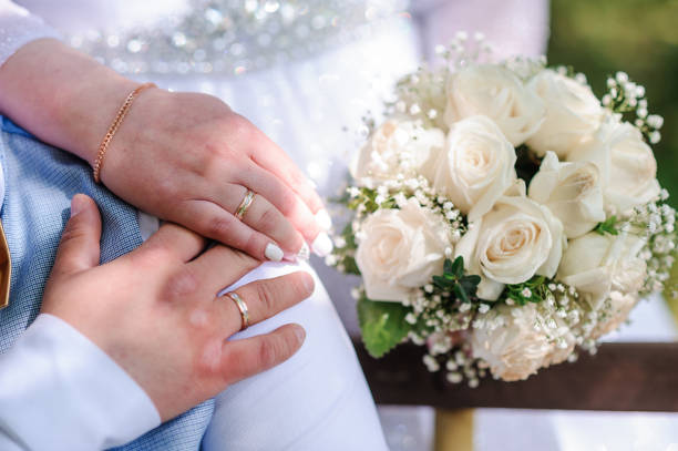 istock Bouquet of flowers in the hand of the bride 1380098425