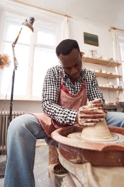 istock Concentrated male ceramist working in his workshop 1380115978