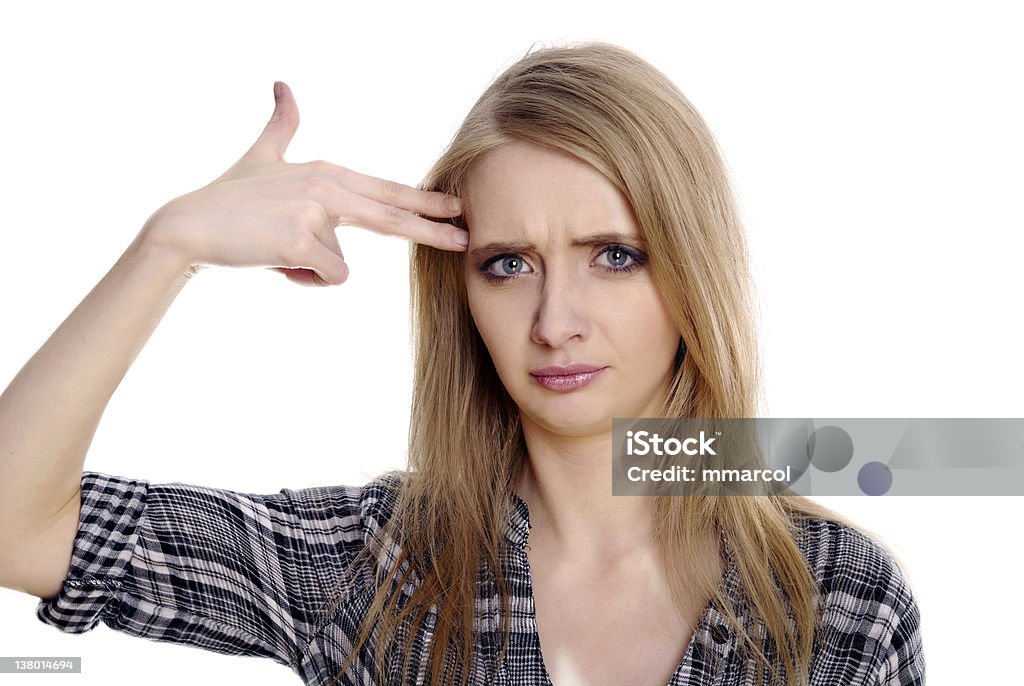 Stressful blond woman in suicide gesture Stressful blond woman showing suicide gesture. Isolated on white background. Adult Stock Photo