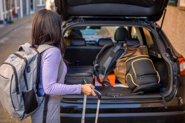 istock Beautiful ethnic tourist preparing for a trip 1380156460