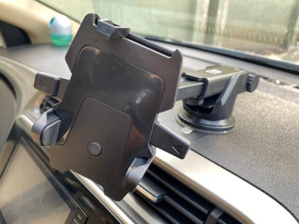 istock Universal mount holder for smart phones or tablet. Car dashboard or wind-shield holder bracket for mobile phone 1380160544