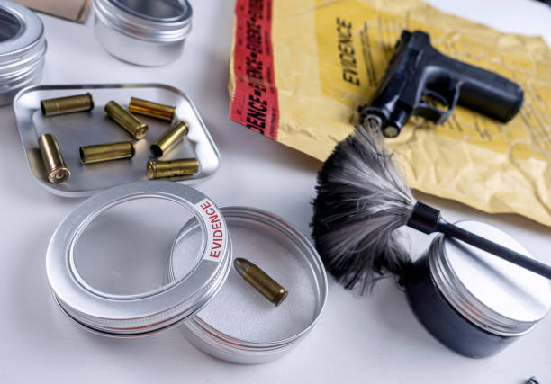 istock Bullet cap along with a gun in ballistic laboratory, conceptual image 1380166331