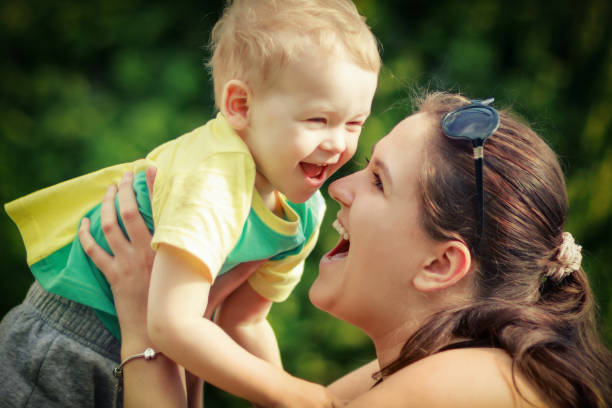 istock Little boy's joy at his mom's hands 1380168474