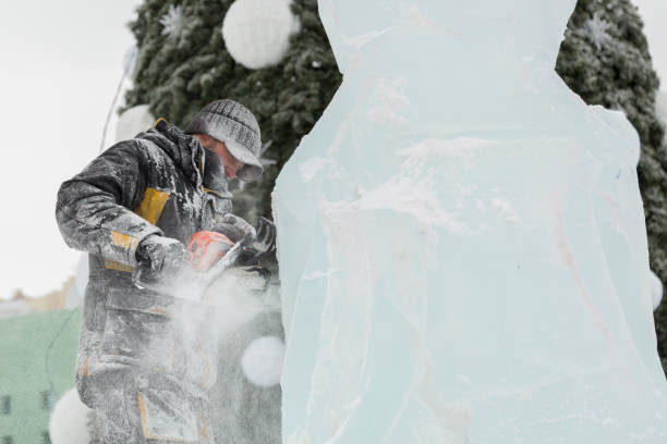 istock Portrait of a sculptor with a chainsaw at work 1380173852