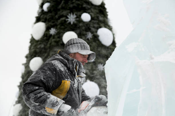 istock Portrait of a sculptor with a chainsaw at work 1380173853