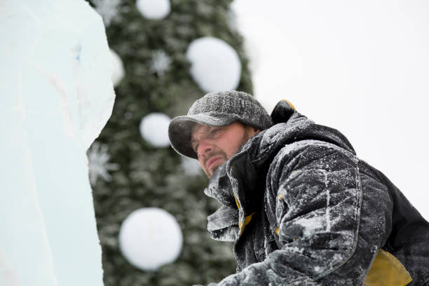 istock Portrait of a sculptor with a chainsaw at work 1380173869