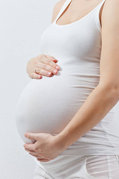 istock Pregnant woman touching here belly 138017665