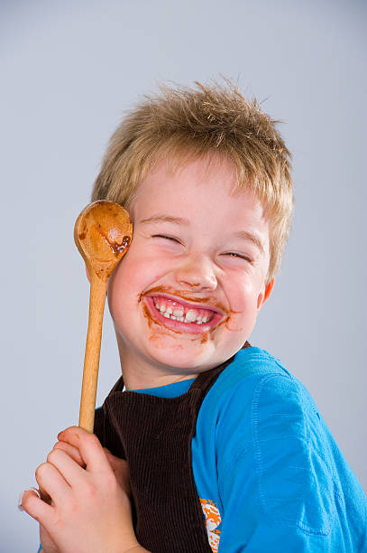 istock boy has got a sweet tooth 138017696
