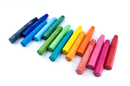 Colored crayons isolated on white background. Close up
