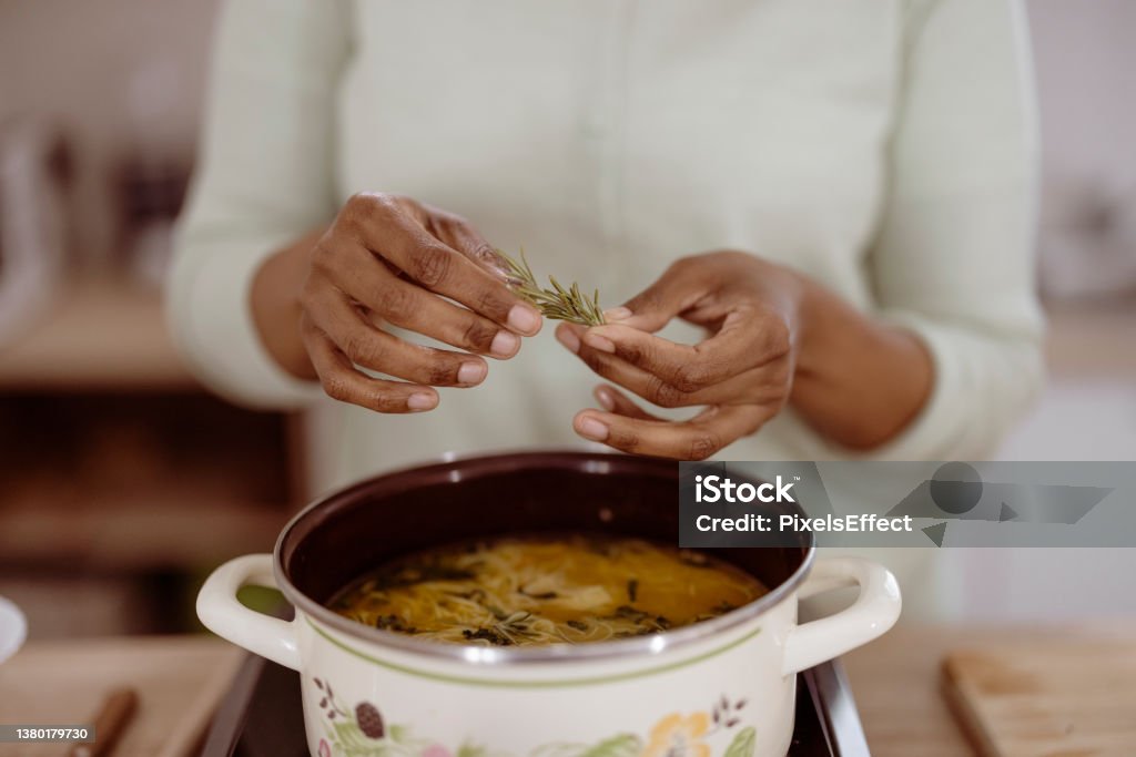 Fresh is best Hands with green ingredients and spicy herbs cooking healthy food on the kitchen Cooking Pan Stock Photo