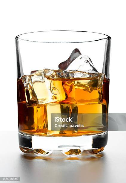 A Measure Of Whisky In A Glass With Ice Stock Photo - Download Image Now - Alcohol - Drink, Brown, Close-up