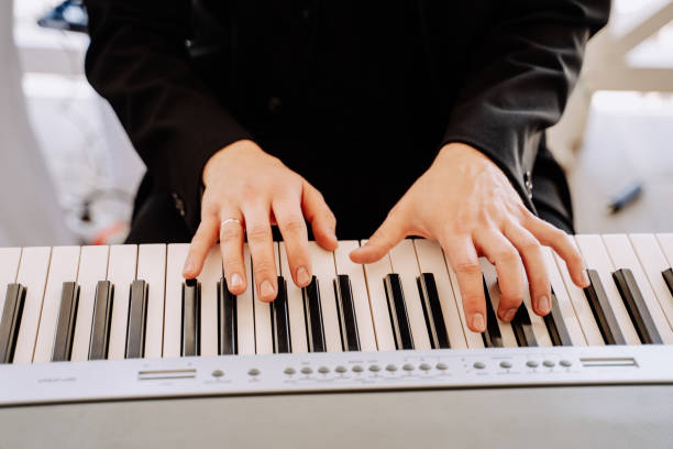 istock Pianist Playing on Piano Close-up Photography 1380193704