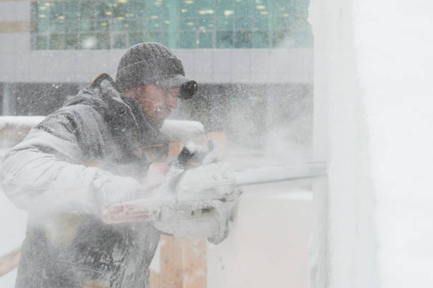 istock The sculptor carves a graceful composition on the ice panel 1380196901