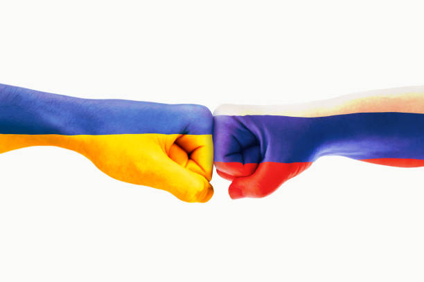 istock Fist human hand Ukraine and Russia , The hands touch war background concept 1380206935