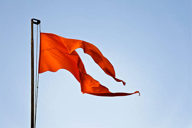 istock fluttering in breeze Hindu temple iconic saffron flag 138021134